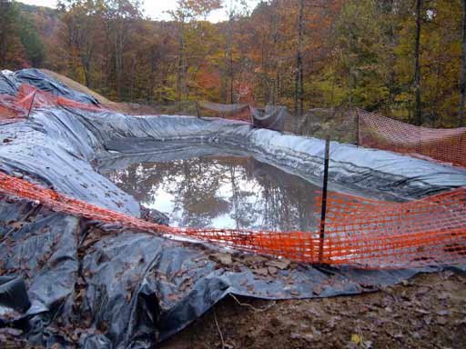 Figure 9. Drilling pit. After it is full of cuttings and chemicals it is folded over ("toxic burrito") and either buried or hauled off