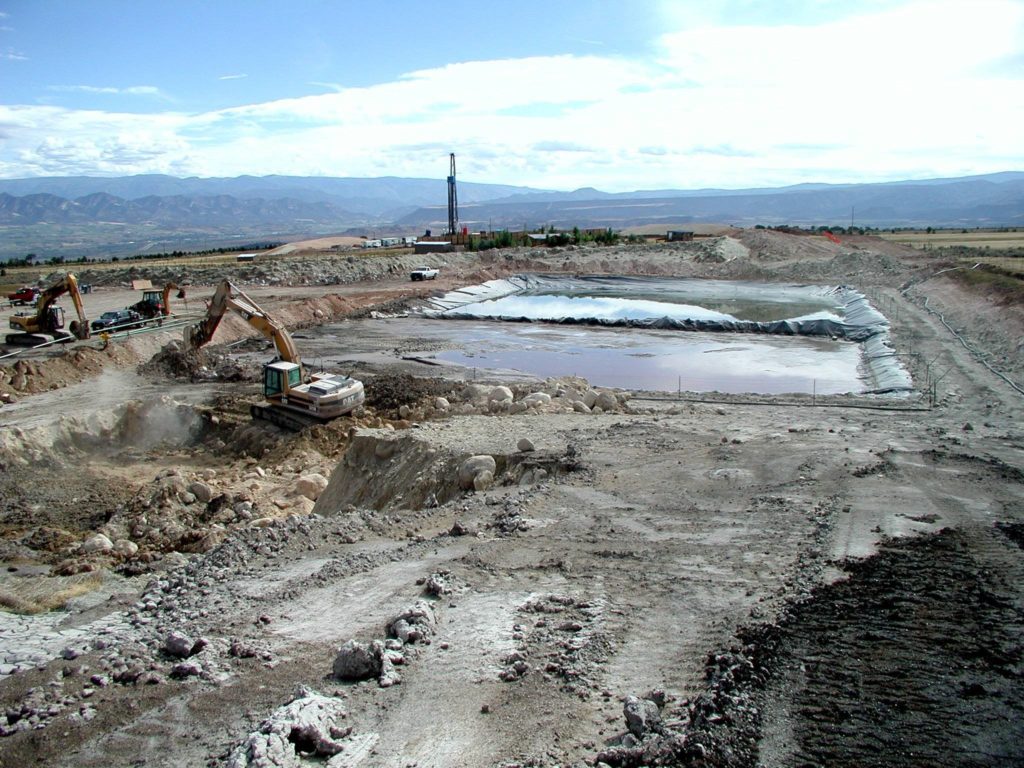 Well pad, evaporation pond and heavy equipment south of Silt, Colorado